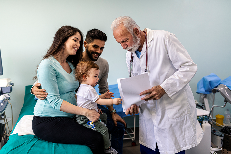 Parents and child visiting medical professional