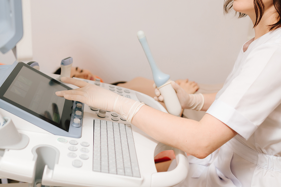 Healthcare worker performing ultrasound examination