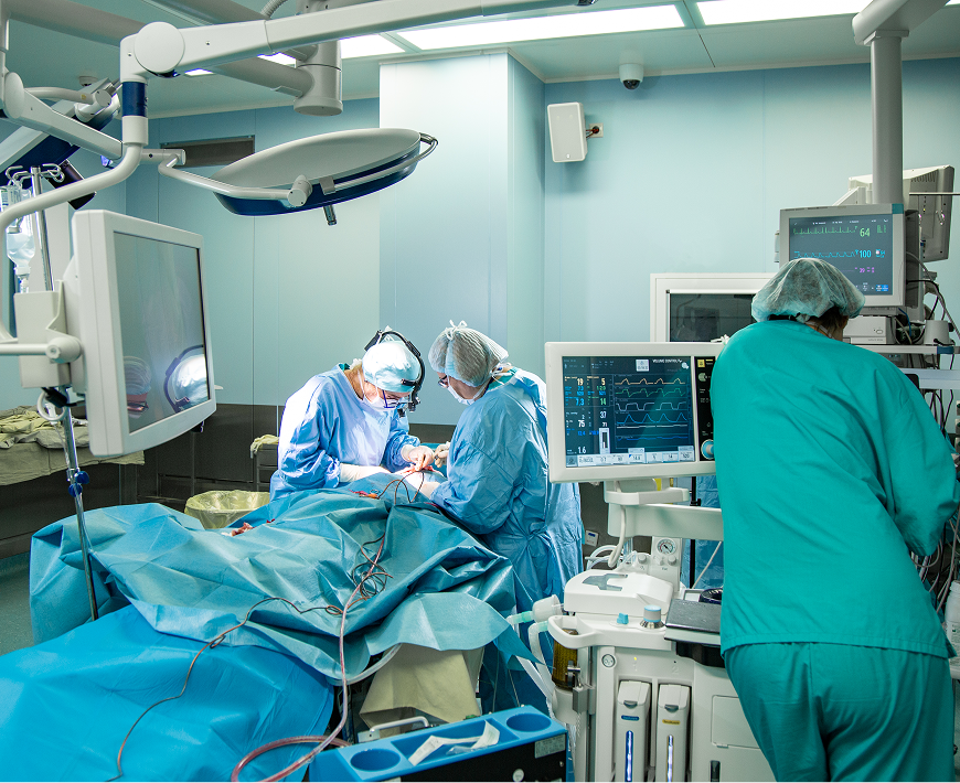 Doctors performing surgery in operating room