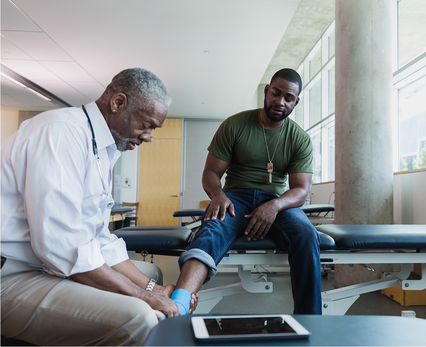 Patient receiving ankle treatment in clinic