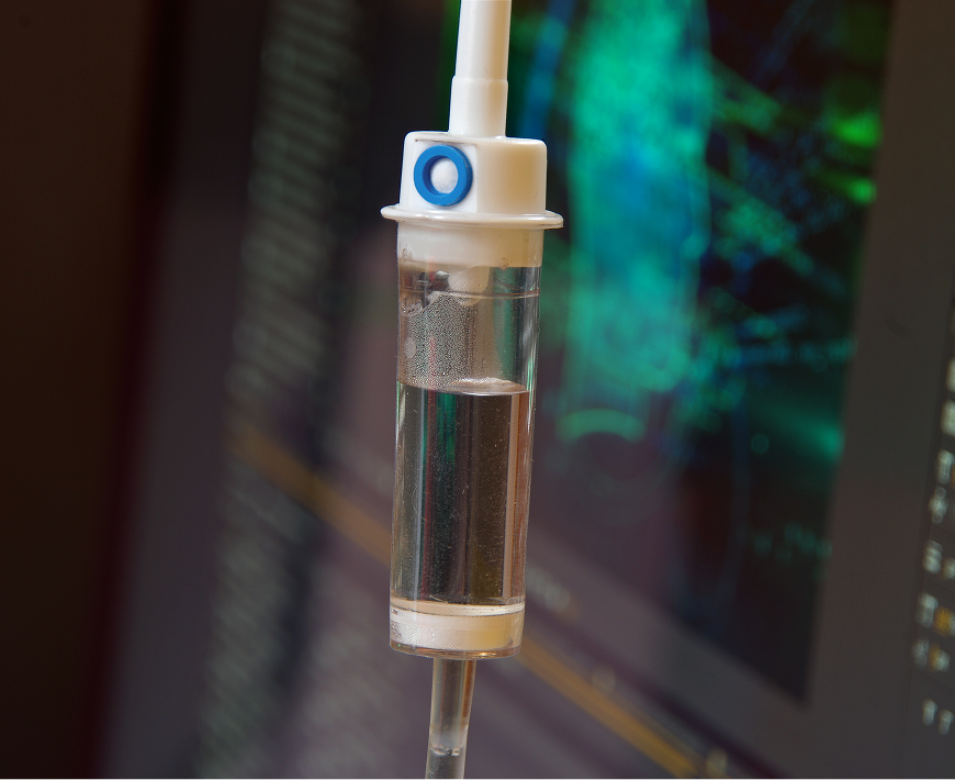 Medical drip in front of monitor